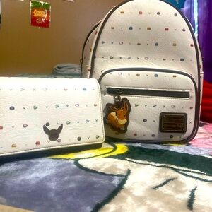 An anime themed, a woman or children clutch purse over the shoulder as well